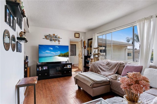 1900 Vanderbilt Ln, Redondo Beach, CA 90278 - living room featuring wood finished floors and a textured ceiling
