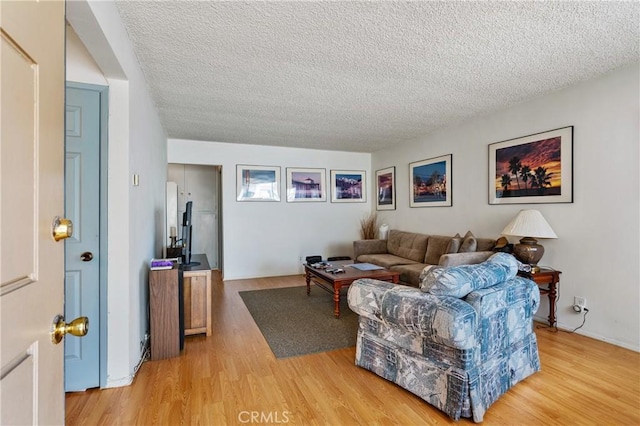 1900 Vanderbilt Ln, Redondo Beach, CA 90278 - living area featuring a textured ceiling and wood finished floors