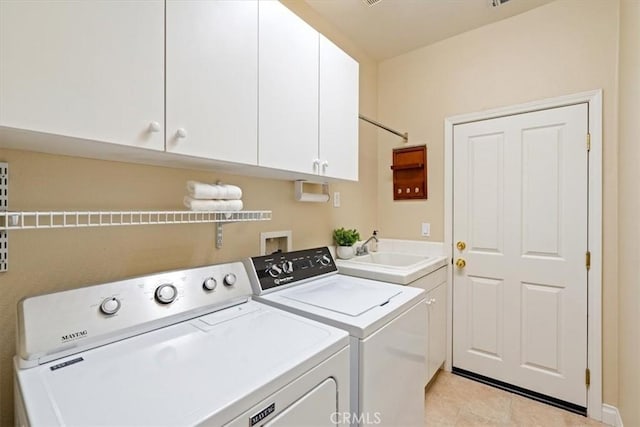 839 Chukar St, Arroyo Grande, CA 93420 - laundry room featuring washer and dryer, cabinet space, and light tile patterned floors