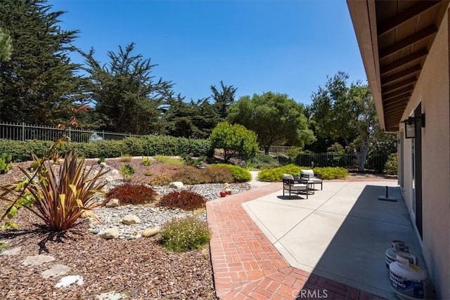 839 Chukar St, Arroyo Grande, CA 93420 - fenced backyard featuring a patio and view of wooded area