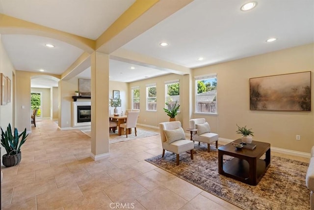 839 Chukar St, Arroyo Grande, CA 93420 - sitting room with arched walkways, recessed lighting, and a glass covered fireplace