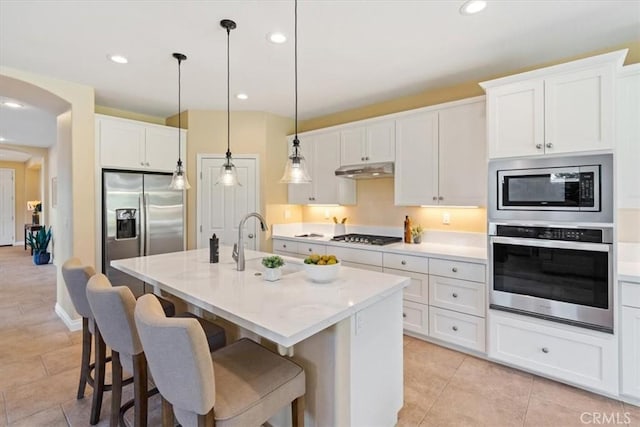 839 Chukar St, Arroyo Grande, CA 93420 - kitchen featuring stainless steel appliances, under cabinet range hood, white cabinets, light tile patterned flooring, and recessed lighting