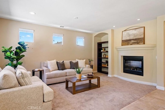 839 Chukar St, Arroyo Grande, CA 93420 - living room with healthy amount of natural light, a glass covered fireplace, recessed lighting, and built in features