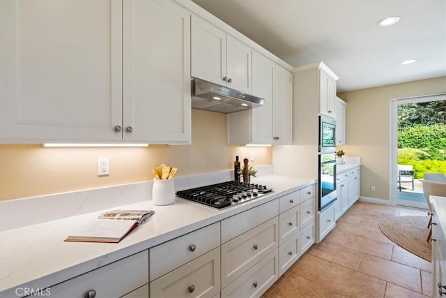 839 Chukar St, Arroyo Grande, CA 93420 - kitchen with appliances with stainless steel finishes, under cabinet range hood, white cabinetry, recessed lighting, and light stone countertops
