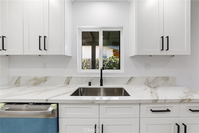 4883 Harvard St, Montclair, CA 91763 - kitchen with dishwasher, white cabinets, and light stone counters