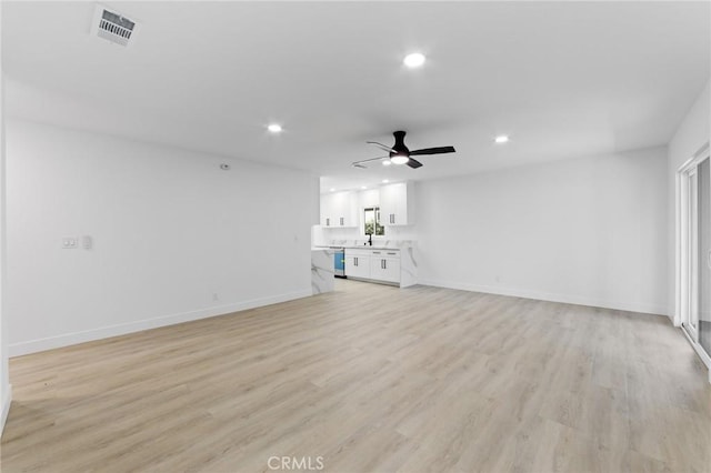 4883 Harvard St, Montclair, CA 91763 - unfurnished living room with recessed lighting, a ceiling fan, and light wood-style flooring