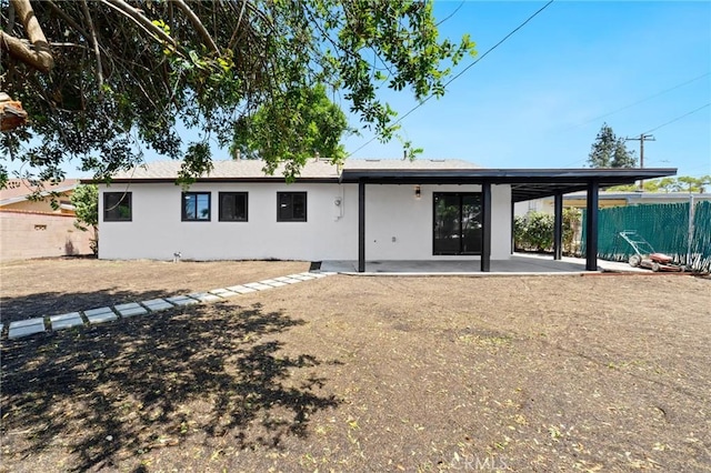 4883 Harvard St, Montclair, CA 91763 - back of house featuring stucco siding and a patio area