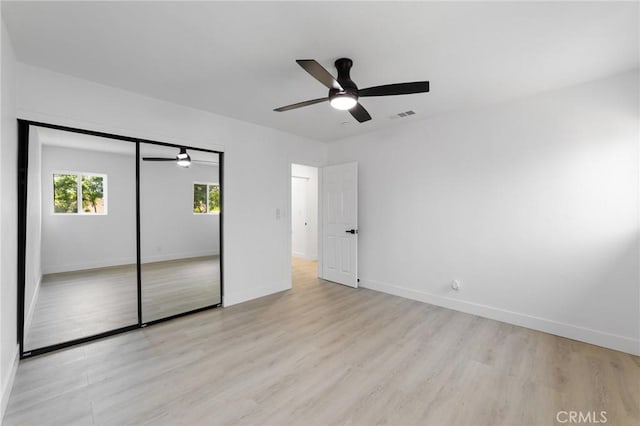 4883 Harvard St, Montclair, CA 91763 - unfurnished bedroom with light wood-type flooring, a closet, and ceiling fan