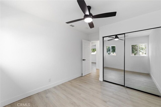 4883 Harvard St, Montclair, CA 91763 - unfurnished bedroom with light wood finished floors, a ceiling fan, and a closet