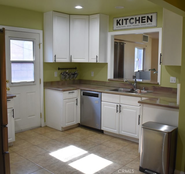 356 S S St, Rialto, CA 92376 - kitchen featuring stainless steel dishwasher, white cabinetry, light tile patterned floors, and recessed lighting