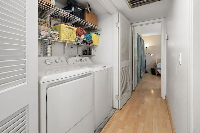 4525 Mississippi St Unit 2, San Diego, CA 92116 - laundry room featuring washing machine and dryer and light wood-style flooring