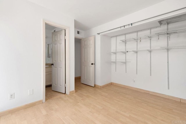 4525 Mississippi St Unit 2, San Diego, CA 92116 - unfurnished bedroom with wood finished floors and a closet