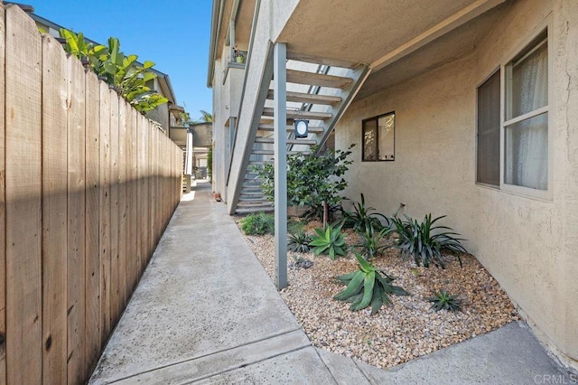4525 Mississippi St Unit 2, San Diego, CA 92116 - view of side of home featuring stucco siding and stairs