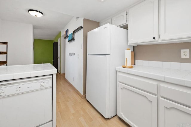 4525 Mississippi St Unit 2, San Diego, CA 92116 - kitchen with white appliances, white cabinets, light wood-type flooring, and tile counters