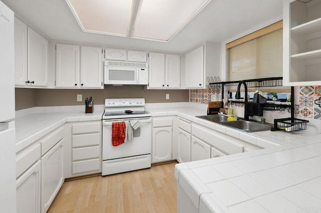 4525 Mississippi St Unit 2, San Diego, CA 92116 - kitchen featuring white appliances, tile countertops, white cabinetry, and light wood-style floors