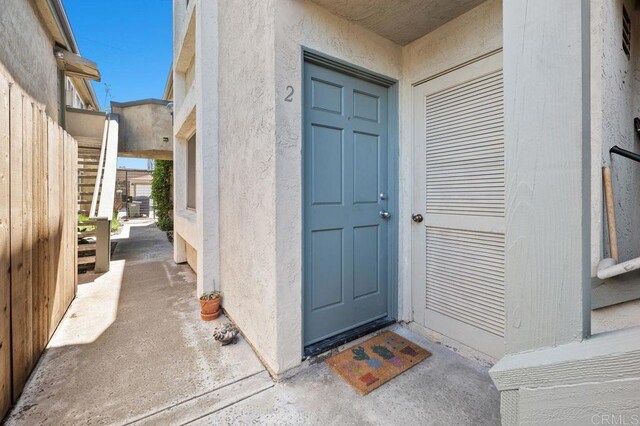 4525 Mississippi St Unit 2, San Diego, CA 92116 - doorway to property featuring stucco siding