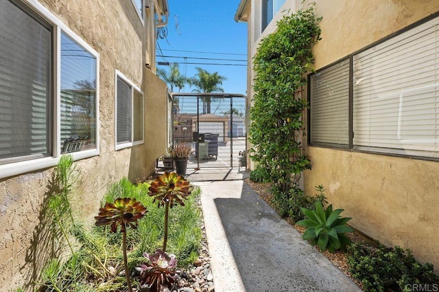 4525 Mississippi St Unit 2, San Diego, CA 92116 - view of property exterior featuring stucco siding and a gate
