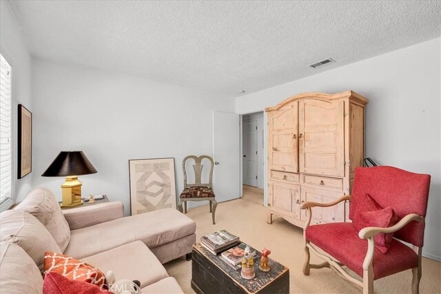 54832 Benecia Trl, Yucca Valley, CA 92284 - living room with light colored carpet and a textured ceiling