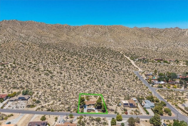 54832 Benecia Trl, Yucca Valley, CA 92284 - aerial view of sparsely populated area with a mountainous background and property boundaries highlighted