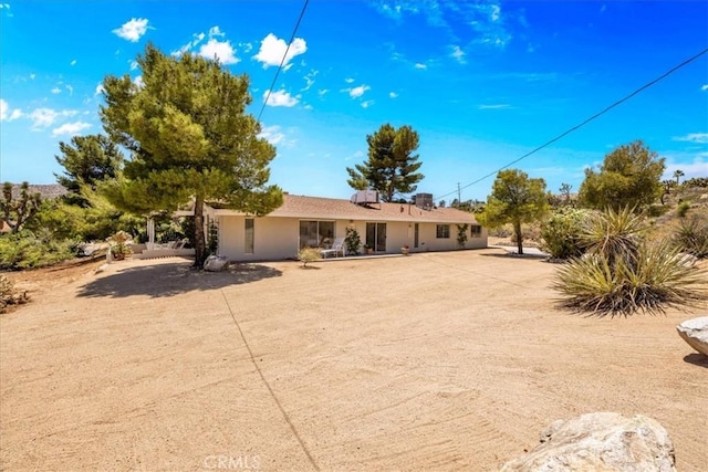54832 Benecia Trl, Yucca Valley, CA 92284 - rear view of house featuring stucco siding