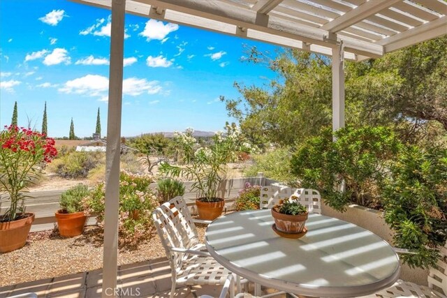 54832 Benecia Trl, Yucca Valley, CA 92284 - view of patio / terrace with a pergola and outdoor dining area