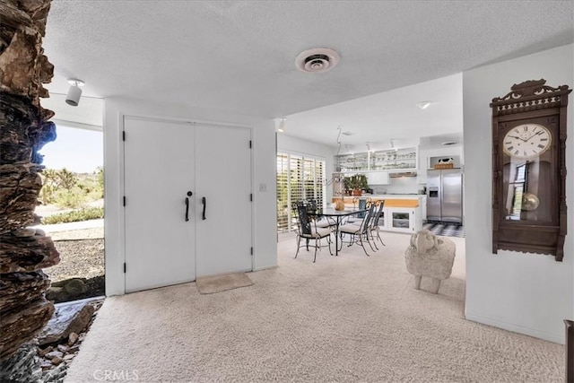 54832 Benecia Trl, Yucca Valley, CA 92284 - foyer featuring a textured ceiling and light colored carpet