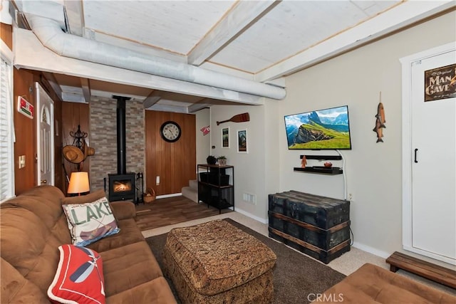 33480 Weeping Willow Dr, Green Valley Lake, CA 92341 - living room with a wood stove, carpet flooring, a wooden ceiling with exposed beams, and wood walls