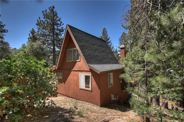 33480 Weeping Willow Dr, Green Valley Lake, CA 92341 - view of property exterior featuring roof with shingles and a chimney