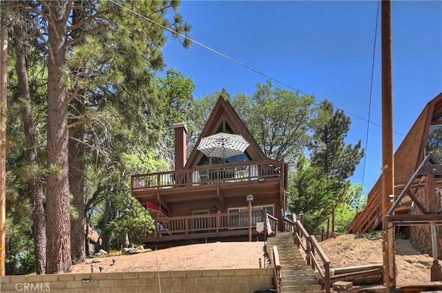 33480 Weeping Willow Dr, Green Valley Lake, CA 92341 - back of property featuring stairway, a wooden deck, and a chimney