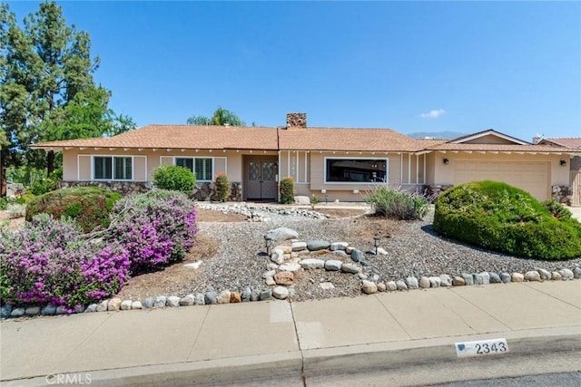 2343 Navarro Dr, Claremont, CA 91711 - ranch-style house featuring stucco siding, a garage, and a chimney