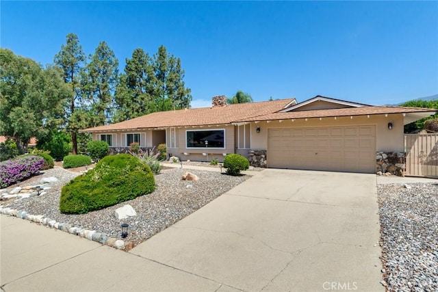 2343 Navarro Dr, Claremont, CA 91711 - ranch-style home with an attached garage, stucco siding, concrete driveway, and a chimney