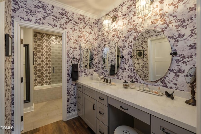 111 S Orange Grove Blvd Unit 203, Pasadena, CA 91105 - bathroom with ornamental molding, vanity, wallpapered walls, a tile shower, and wood finished floors