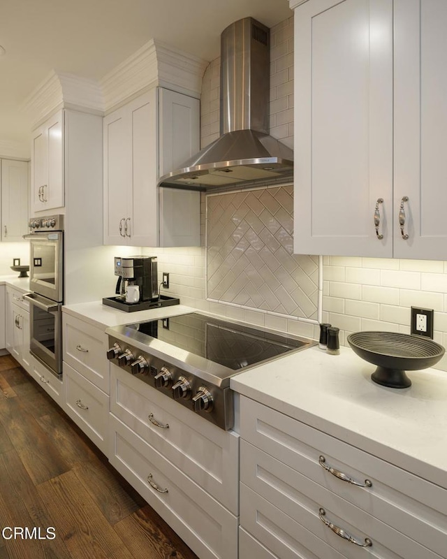 111 S Orange Grove Blvd Unit 203, Pasadena, CA 91105 - kitchen featuring wall chimney exhaust hood, stovetop, light countertops, and tasteful backsplash