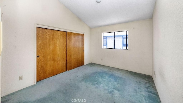 14927 Condon Ave Unit 7, Lawndale, CA 90260 - unfurnished bedroom with carpet, vaulted ceiling, and a closet