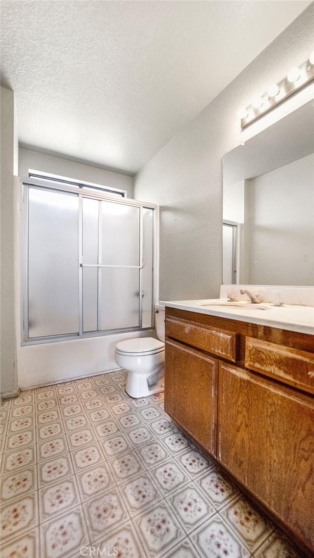 14927 Condon Ave Unit 7, Lawndale, CA 90260 - bathroom with vanity, bath / shower combo with glass door, and a textured ceiling