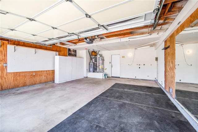8761 Sandhill Dr, Riverside, CA 92508 - garage with a garage door opener, strapped water heater, and water heater