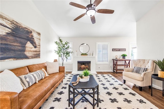 8761 Sandhill Dr, Riverside, CA 92508 - living room with wood finished floors, ceiling fan, a fireplace, and lofted ceiling