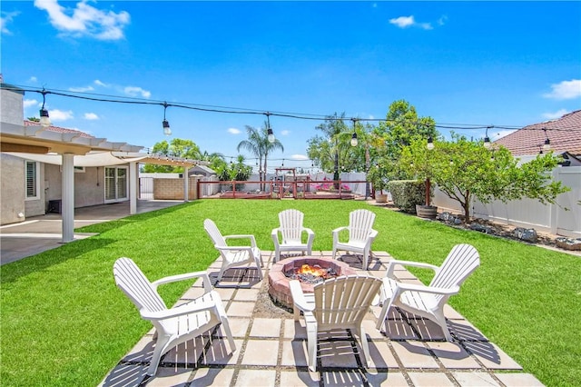 8761 Sandhill Dr, Riverside, CA 92508 - fenced backyard with a fire pit and a patio area