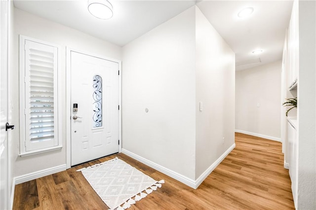 8761 Sandhill Dr, Riverside, CA 92508 - foyer with baseboards and light wood finished floors