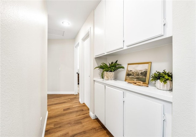 8761 Sandhill Dr, Riverside, CA 92508 - corridor featuring attic access, light wood-type flooring, and recessed lighting