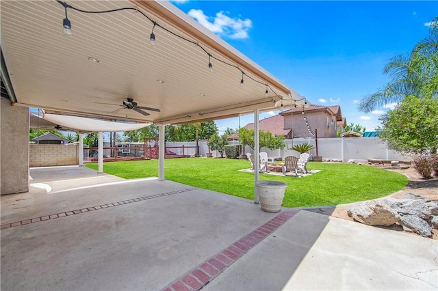 8761 Sandhill Dr, Riverside, CA 92508 - fenced backyard featuring a ceiling fan and a patio