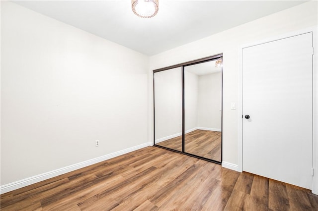 8761 Sandhill Dr, Riverside, CA 92508 - unfurnished bedroom with light wood-style flooring and a closet