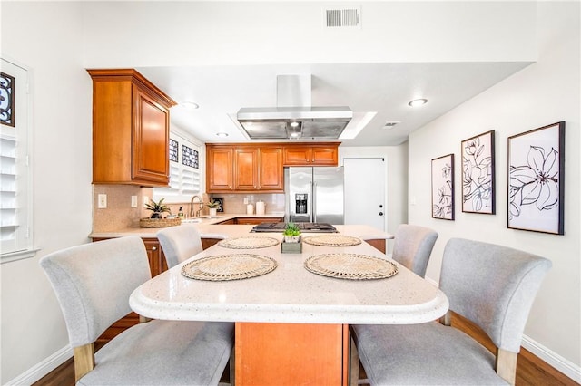 8761 Sandhill Dr, Riverside, CA 92508 - dining space with wood finished floors and recessed lighting