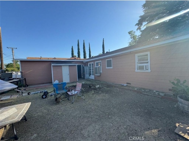9167 Citrus Ave, Fontana, CA 92335 - rear view of property featuring cooling unit and a storage shed
