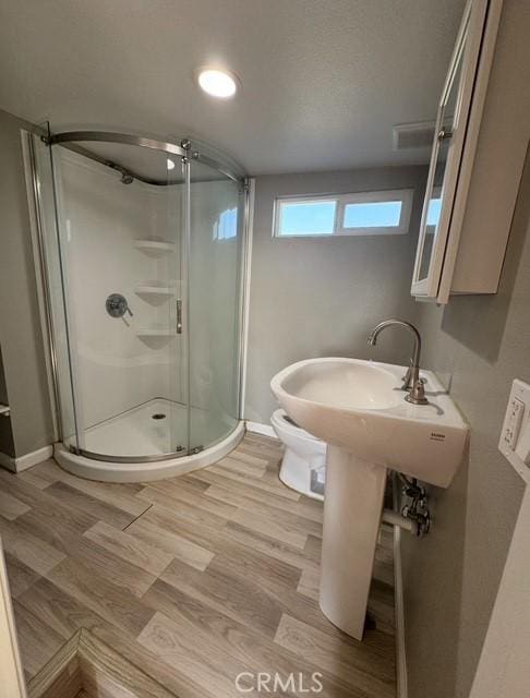 9167 Citrus Ave, Fontana, CA 92335 - full bath featuring a stall shower and wood finished floors