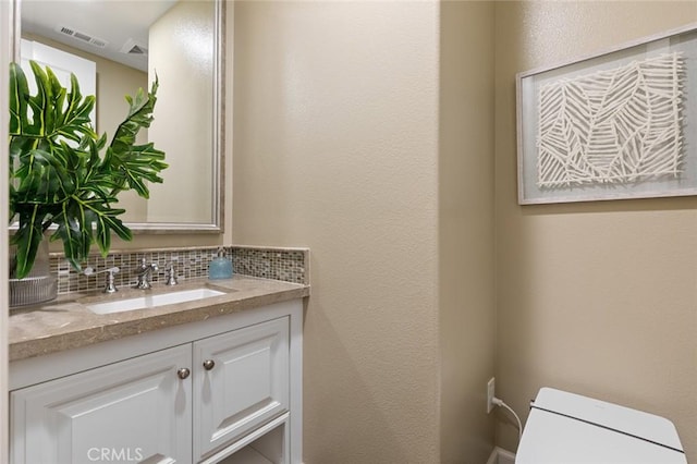 17472 Oakbluffs Ln, Huntington Beach, CA 92649 - bathroom featuring vanity and backsplash