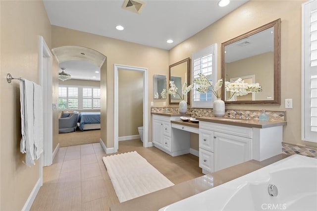 17472 Oakbluffs Ln, Huntington Beach, CA 92649 - ensuite bathroom with vanity, a whirlpool tub, and recessed lighting