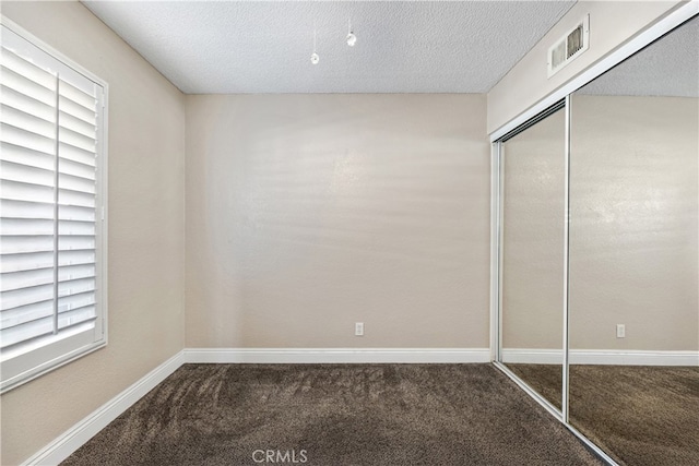 3718 Berkshire Rd, Pico Rivera, CA 90660 - unfurnished bedroom featuring carpet floors, a closet, and a textured ceiling