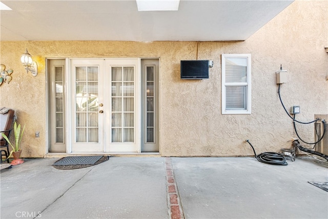 3718 Berkshire Rd, Pico Rivera, CA 90660 - entrance to property featuring french doors, stucco siding, and a patio area