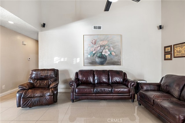 3718 Berkshire Rd, Pico Rivera, CA 90660 - tiled living room with high vaulted ceiling and a ceiling fan